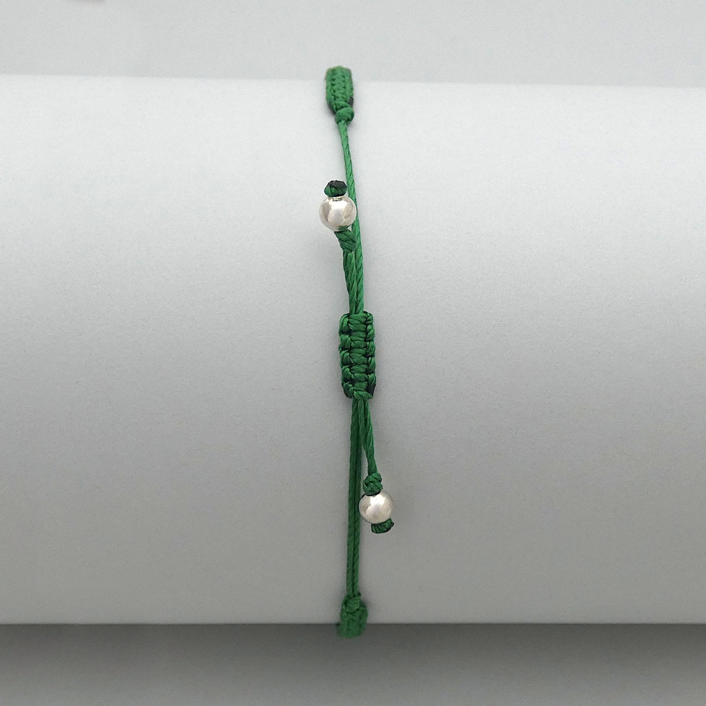 7” adjustable Christmas green macramé bracelet for adults with silver plated bead ends.
