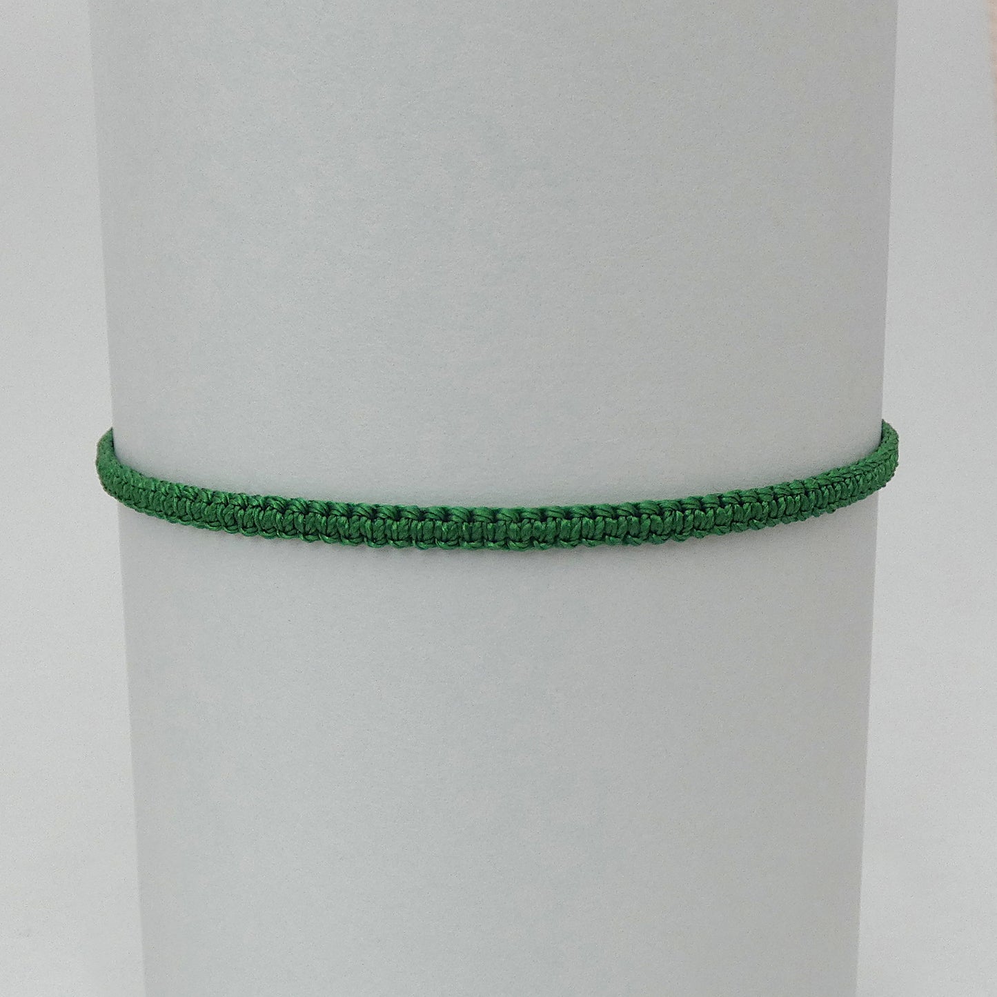 7” adjustable Christmas green macramé bracelet for adults with silver plated bead ends.