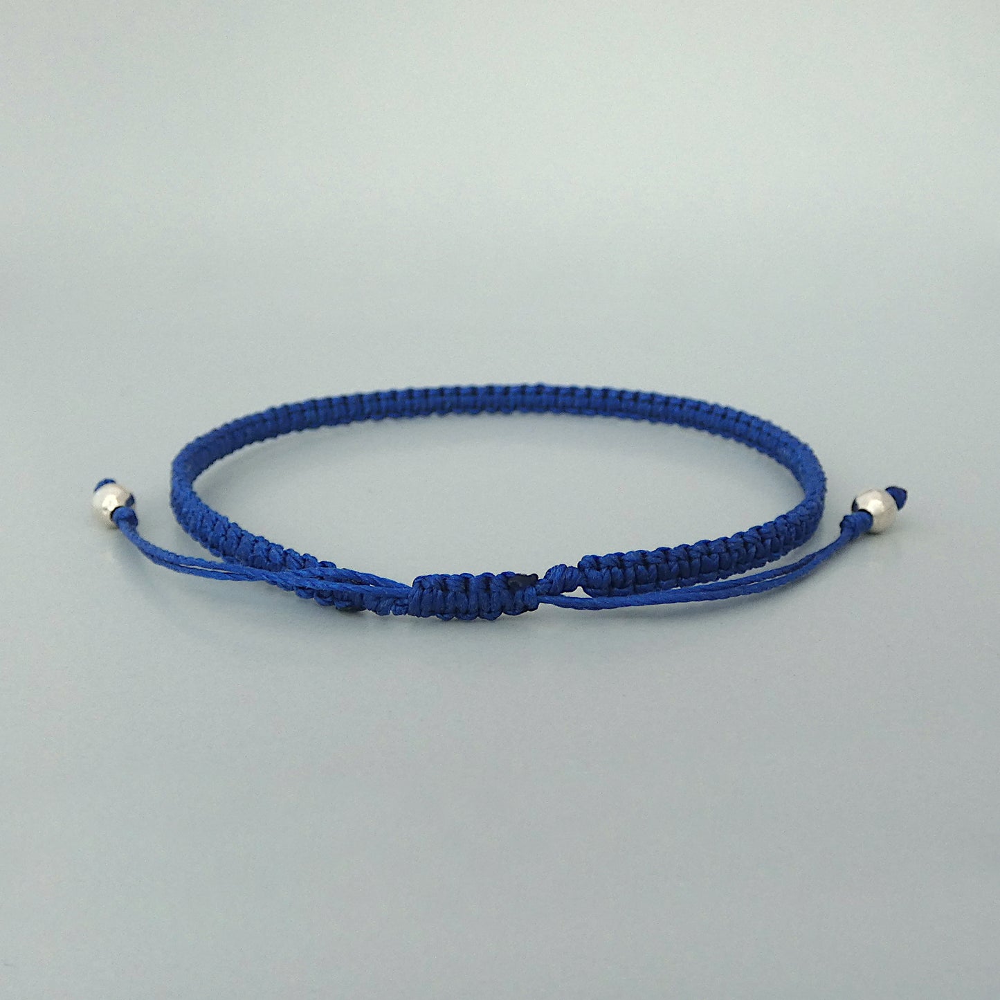 7” adjustable Royal blue coloured macramé bracelet for adults with silver plated bead ends.