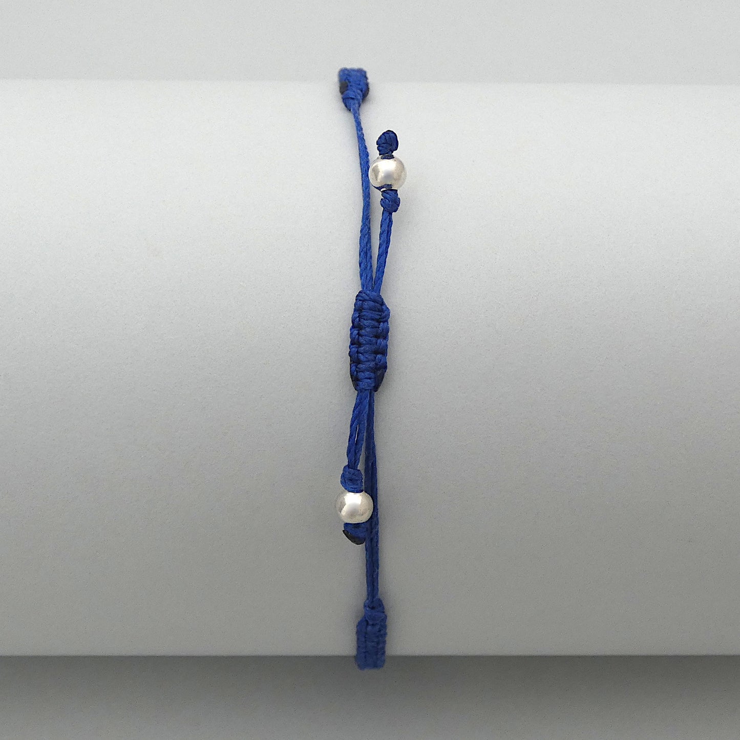 7” adjustable Royal blue coloured macramé bracelet for adults with silver plated bead ends.