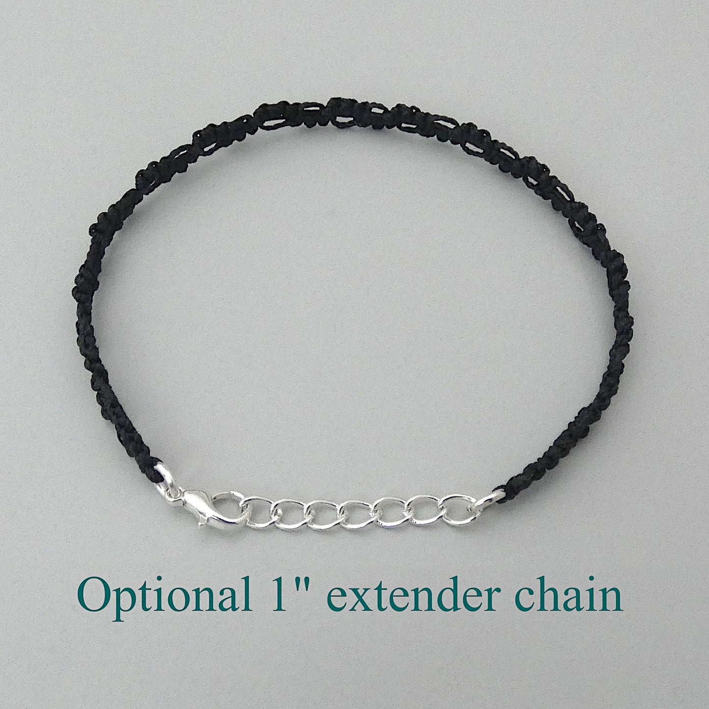 Black macramé bracelet tied with an intricate lace effect with silver plated clasp and optional 1” extender chain.