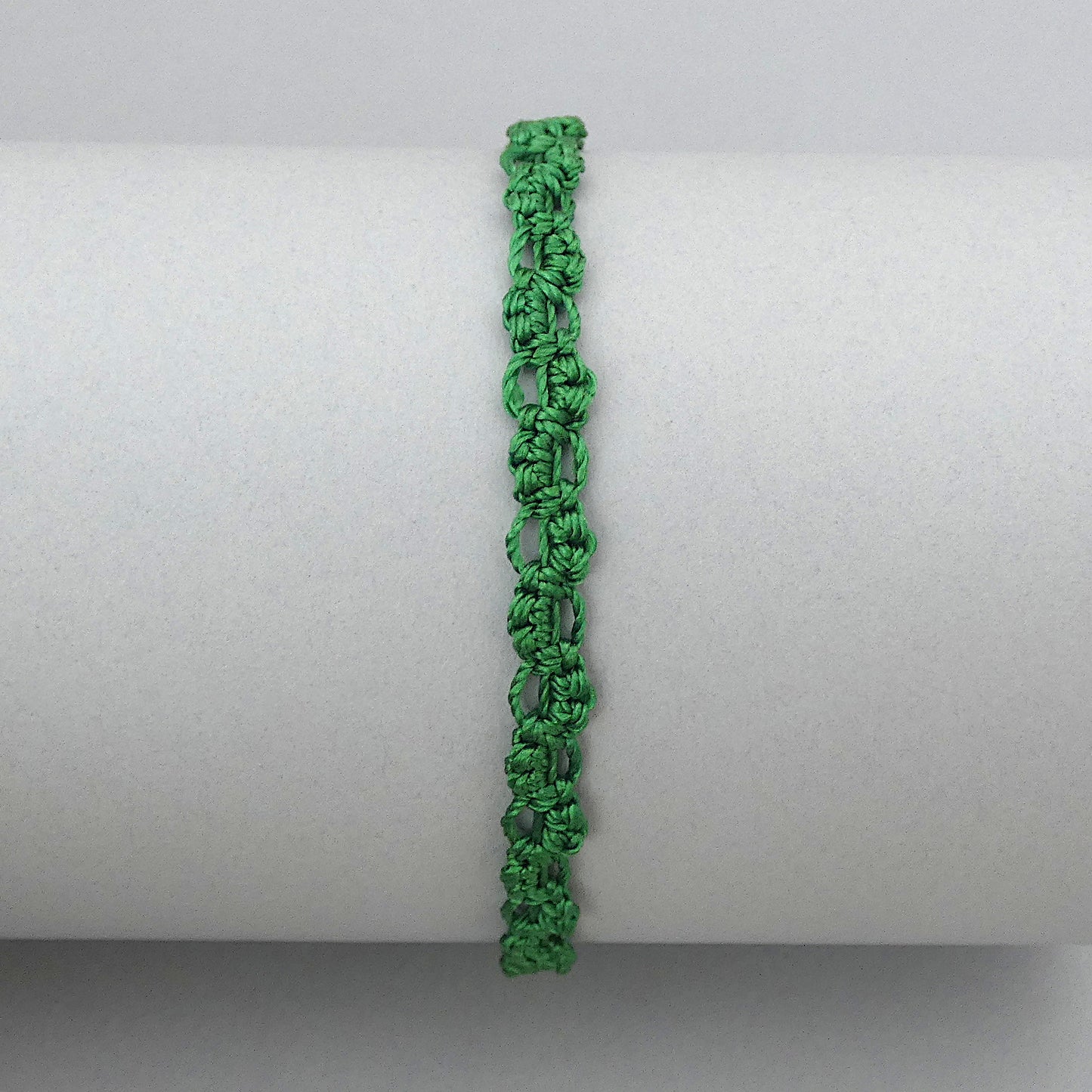 Christmas green macramé bracelet tied with an intricate lace effect with silver plated clasp and optional 1” extender chain.