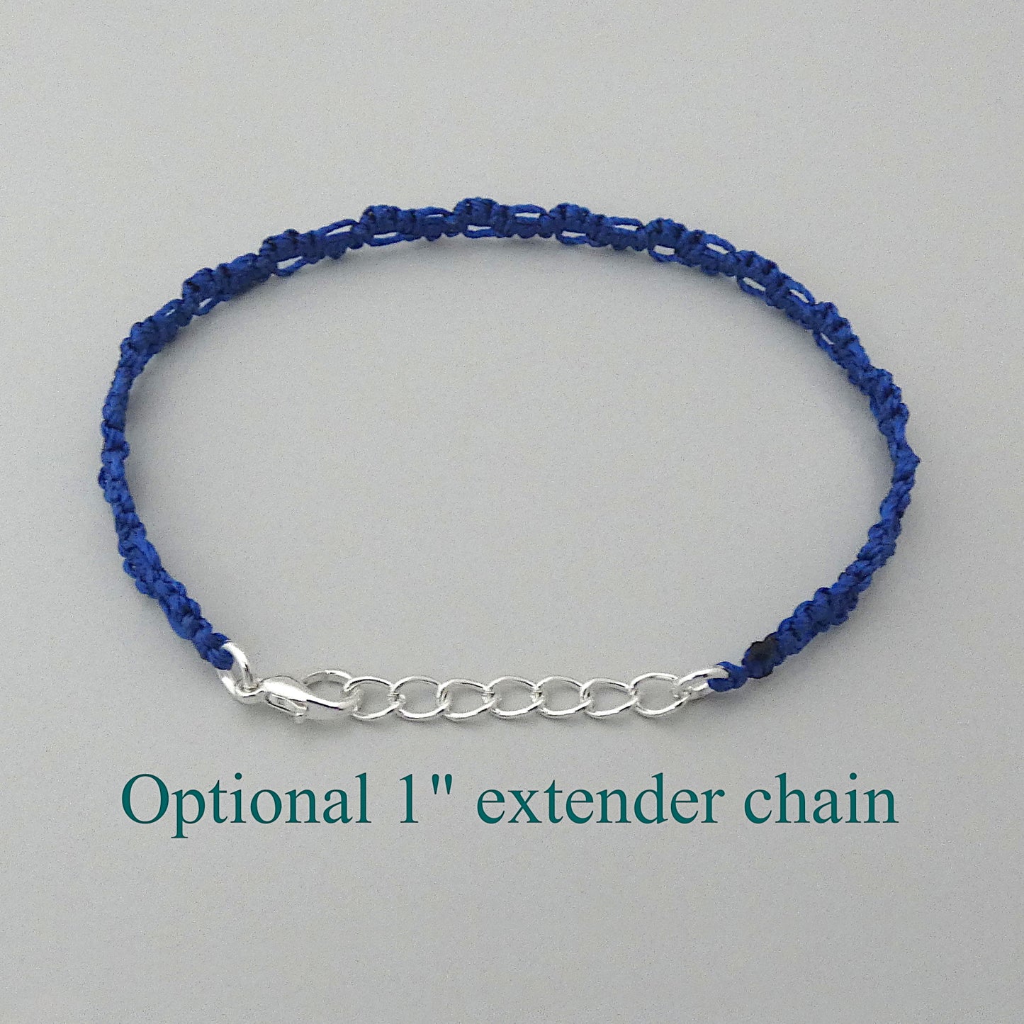 Royal blue macramé bracelet tied with an intricate lace effect with silver plated clasp and optional 1” extender chain.