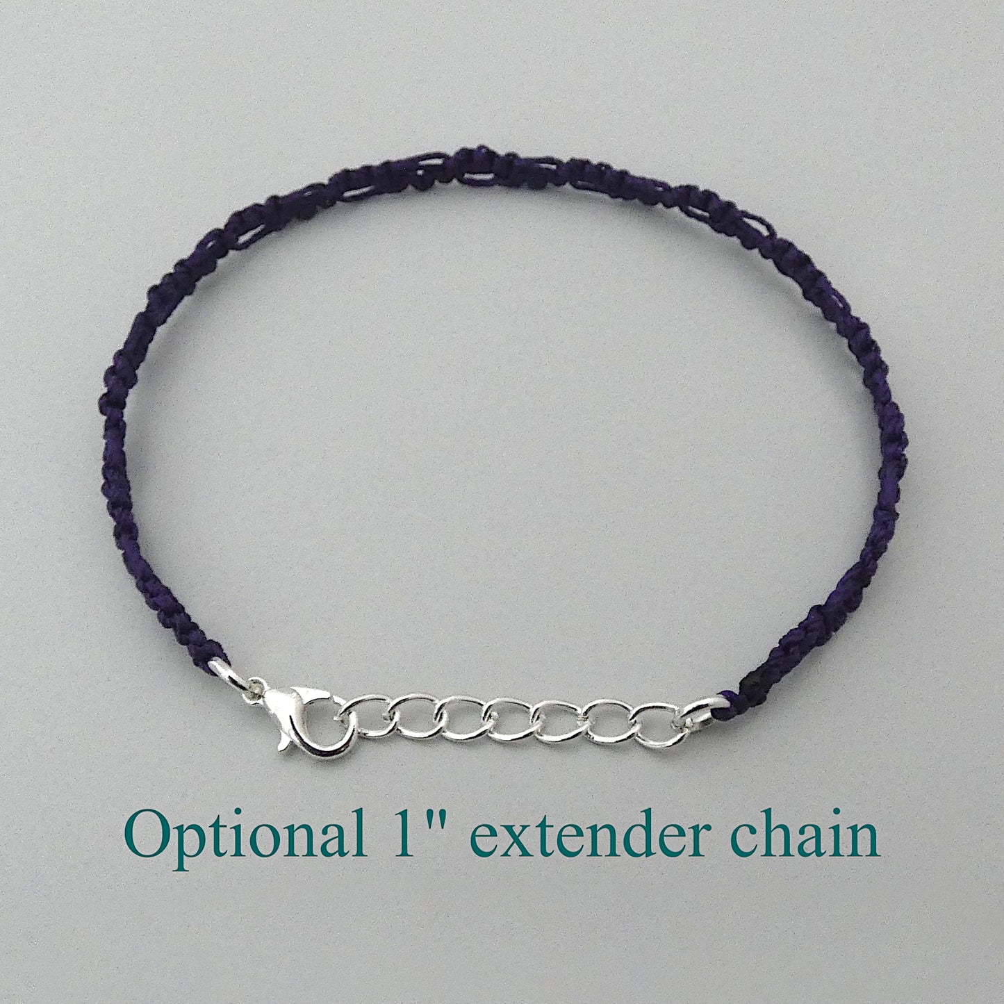 Dark purple macramé bracelet tied with an intricate lace effect with silver plated clasp and optional 1” extender chain.