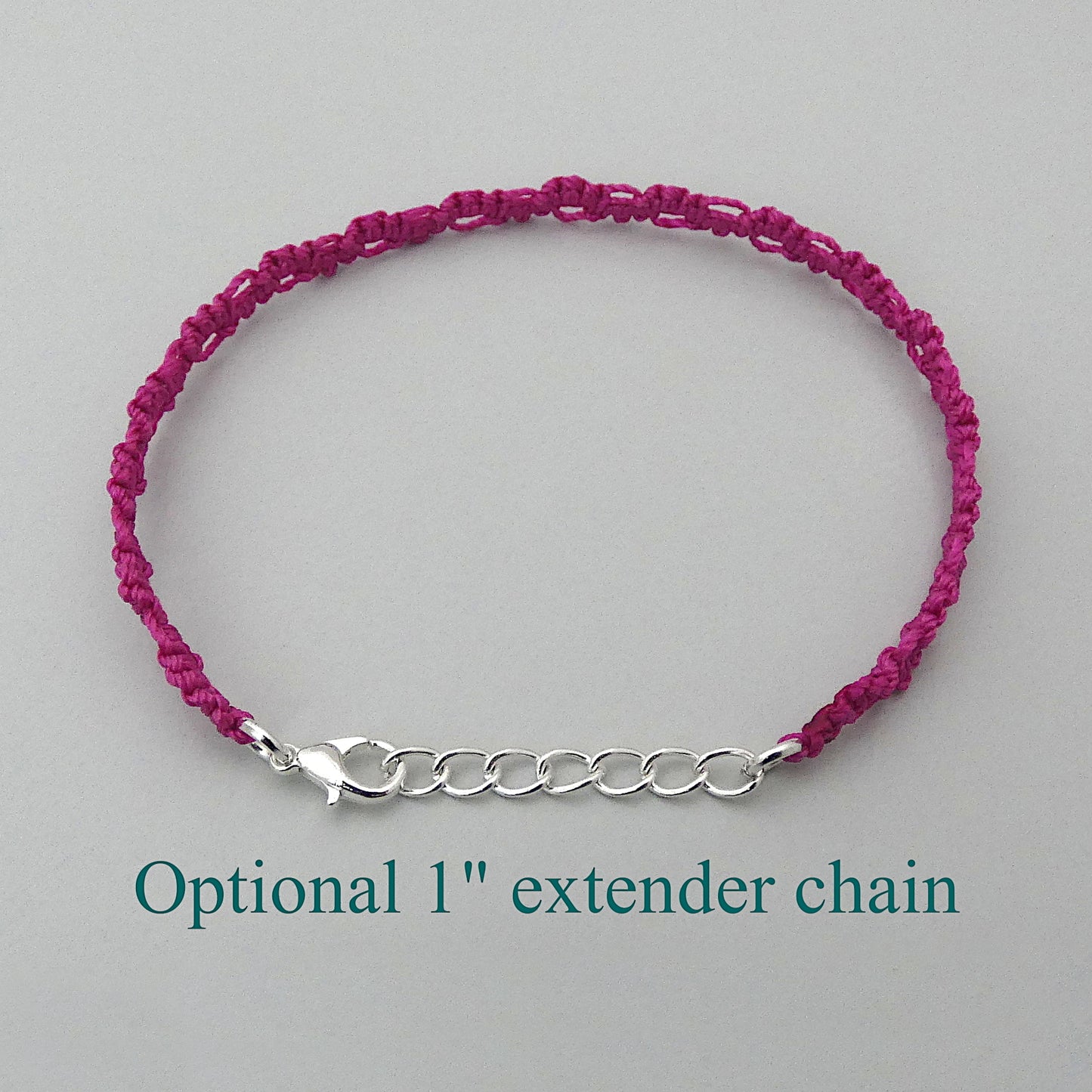 Magenta purple macramé bracelet tied with an intricate lace effect with silver plated clasp and optional 1” extender chain.