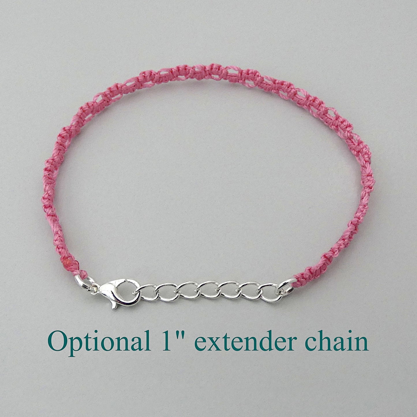 Pink macramé bracelet tied with an intricate lace effect with silver plated clasp and optional 1” extender chain.