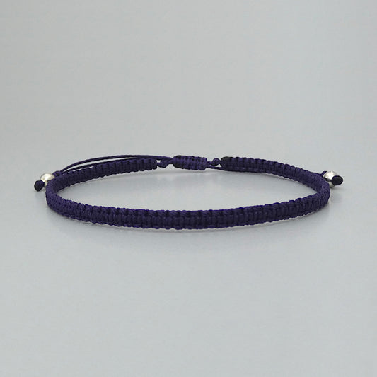 7” adjustable dark purple macramé bracelet for adults with silver plated bead ends.