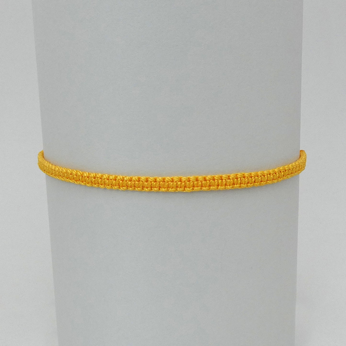 7” adjustable Golden yellow macramé bracelet for adults with silver plated bead ends.