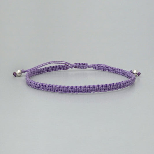7” adjustable orchid purple macramé bracelet for adults with silver plated bead ends.