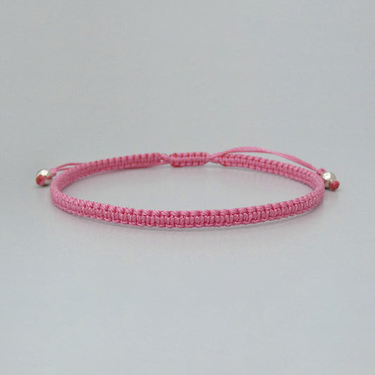 7” adjustable pink coloured macramé bracelet for adults with silver plated bead ends.