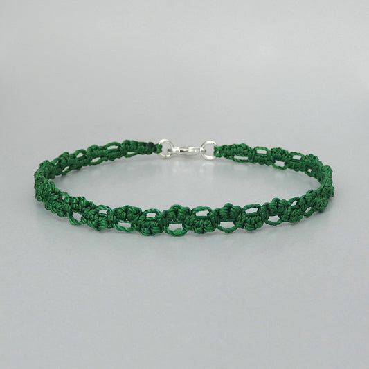 Christmas green macramé bracelet tied with an intricate lace effect with silver plated clasp and optional 1” extender chain.