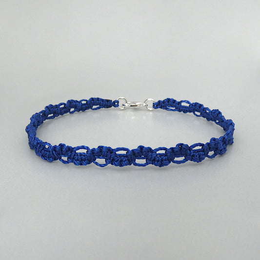 Royal blue macramé bracelet tied with an intricate lace effect with silver plated clasp and optional 1” extender chain.