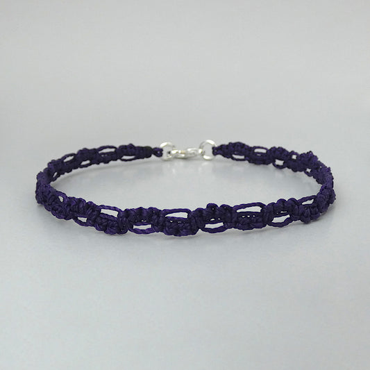 Dark purple macramé bracelet tied with an intricate lace effect with silver plated clasp and optional 1” extender chain.