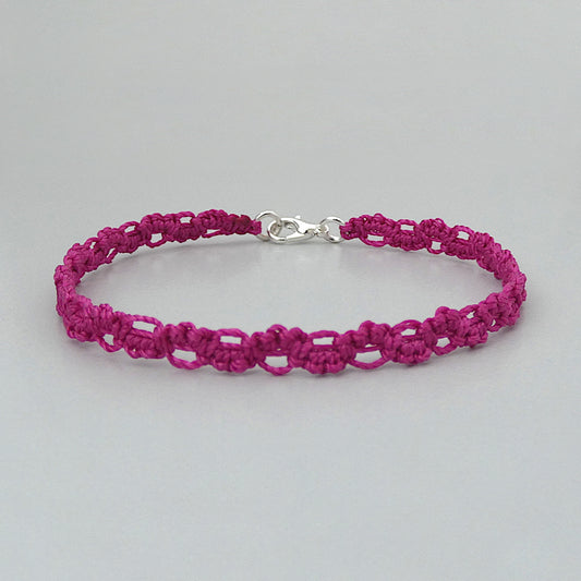 Magenta purple macramé bracelet tied with an intricate lace effect with silver plated clasp and optional 1” extender chain.