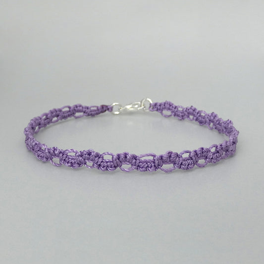 Orchid purple macramé bracelet tied with an intricate lace effect with silver plated clasp and optional 1” extender chain.
