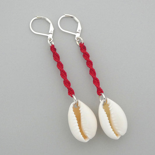Silver plated leverback earrings with cowrie shells and bright red macramé twist detail.